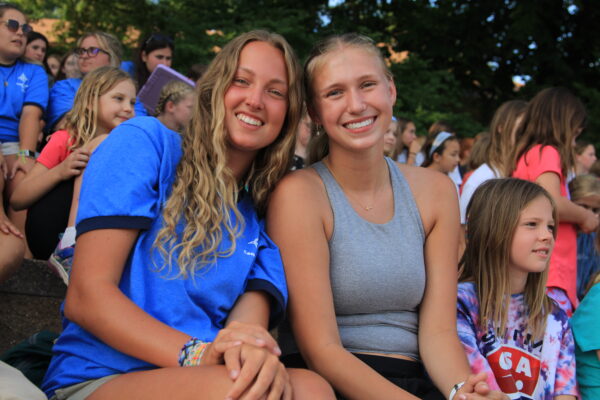 image of two camp counselors preparing for a summer.