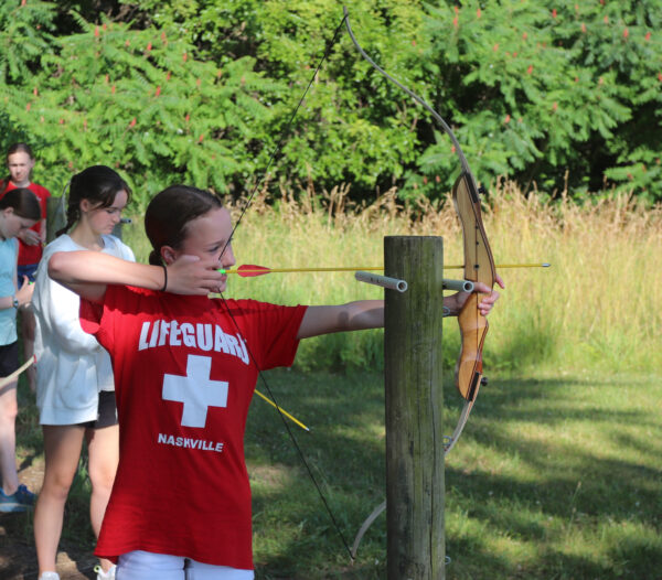 Image of a girl practicing archery.